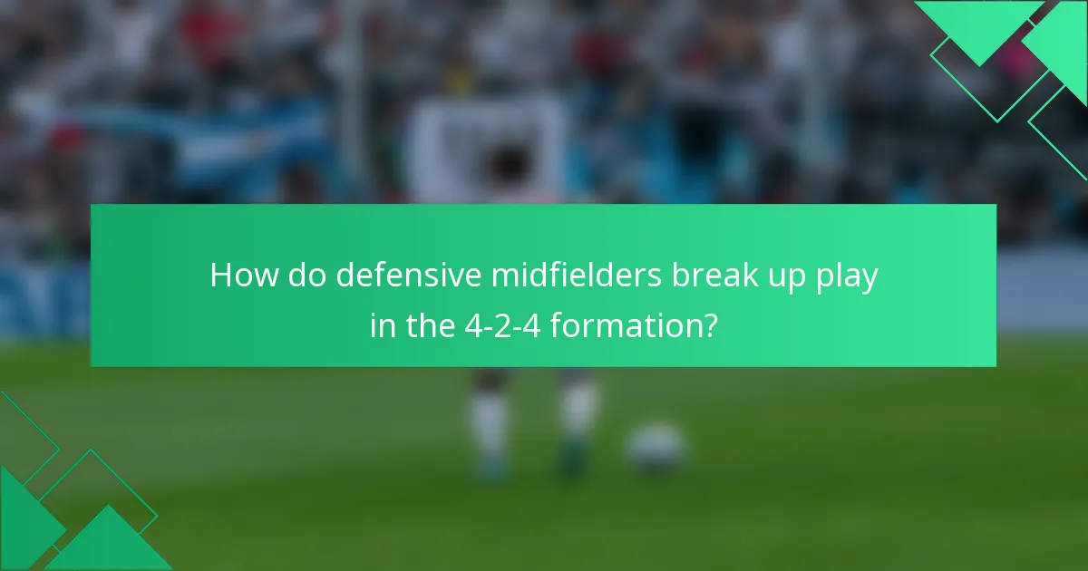 How do defensive midfielders break up play in the 4-2-4 formation?
