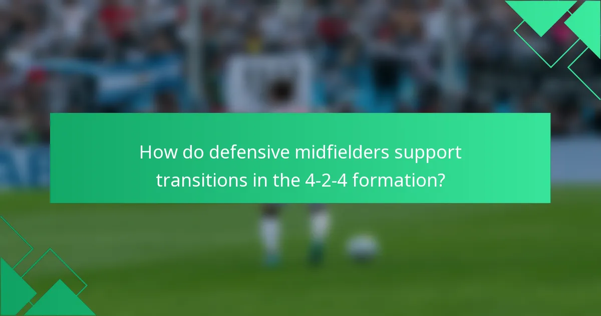 How do defensive midfielders support transitions in the 4-2-4 formation?
