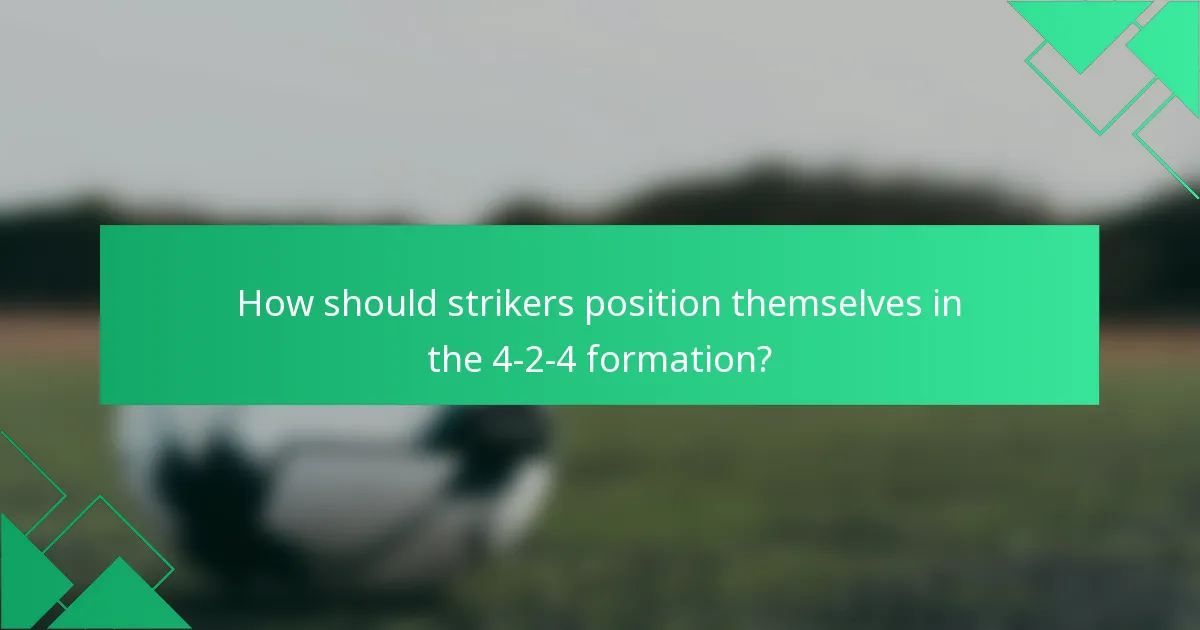 How should strikers position themselves in the 4-2-4 formation?