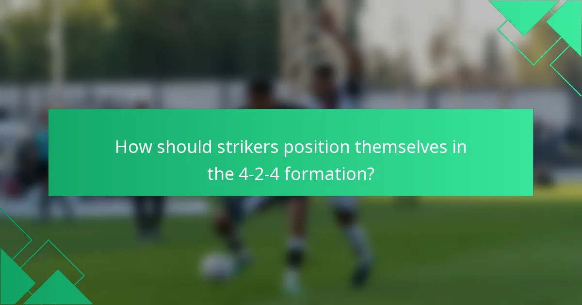 How should strikers position themselves in the 4-2-4 formation?